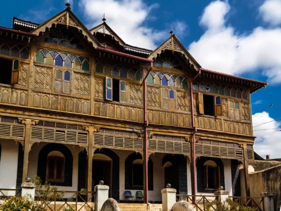 A low-angle view of the wooden Rimbaud House and Museum in Harar, Ethiopia.