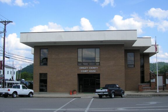 A street-level view of the Owsley County Courthouse and surrounding pavement in Booneville, Kentucky.