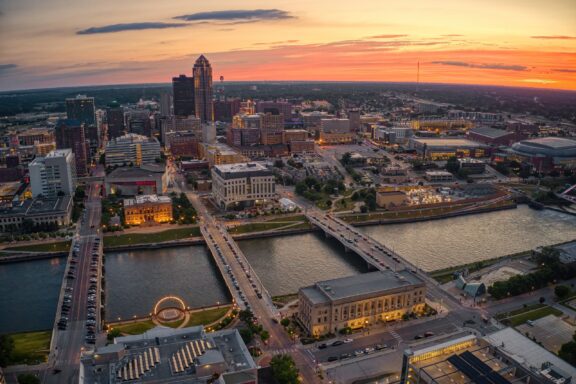 An aerial view of the downtown Des Moines, Iowa skyline at dusk in Polk County.