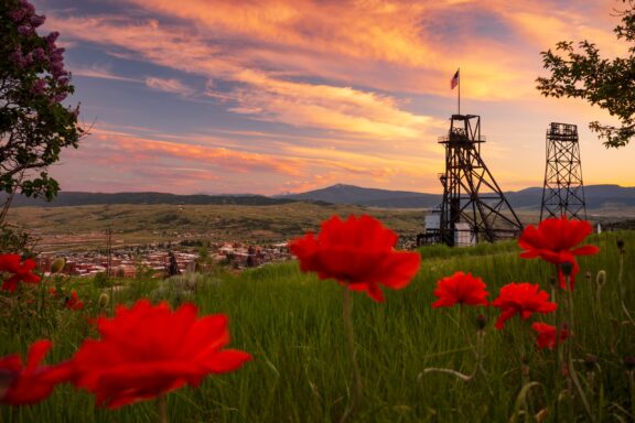 A view of a headframe overlooking Butte, Montana at dusk.