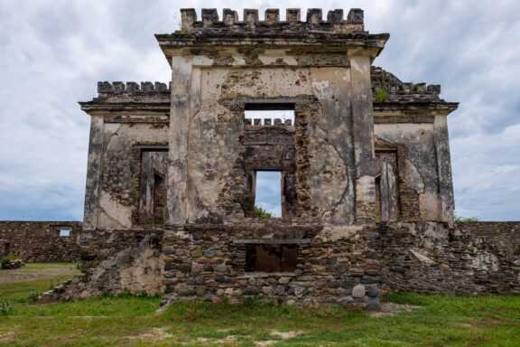 Ruins of an Old Stone Prison Building Ruins of Ai Pelo Prison, once a symbol of Portuguese colonial rule