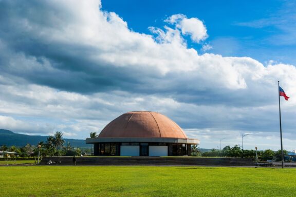 Dome-shaped Building under Blue Sky with Clouds Fale Fono, the Parliament House of Apia