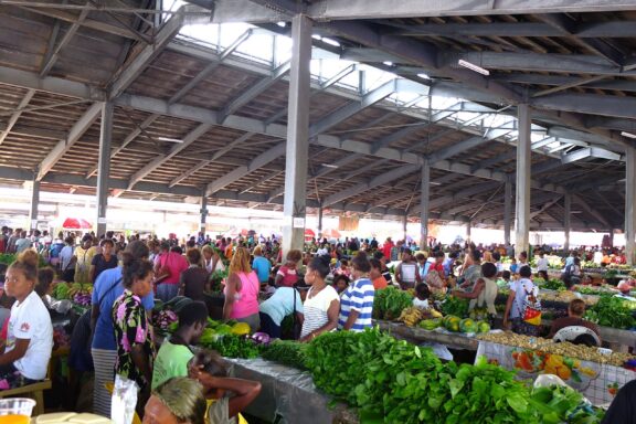 Bustling Market Scene with Vendors and Shoppers Central Market in Honiara, a bustling hub of local commerce