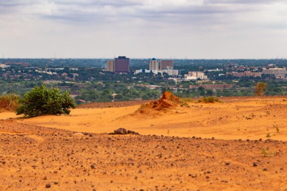 Niamey's skyline, emphasizing Niamey's geographical significance as a key trading hub