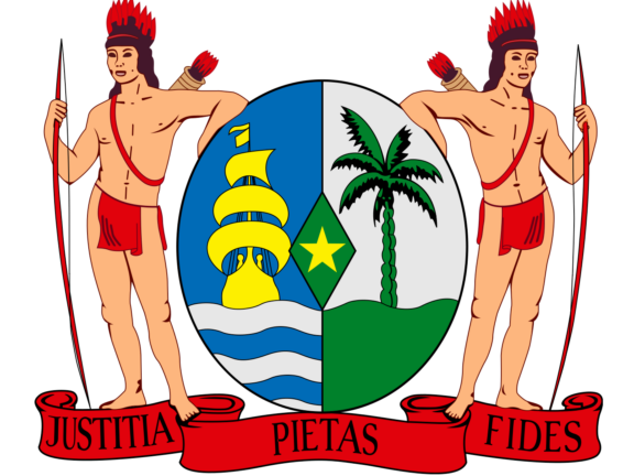 Coat of arms of Suriname featuring a shield with a ship, a palm tree, and a star, flanked by two indigenous figures and a banner with the words "Justitia β Pietas β Fides".