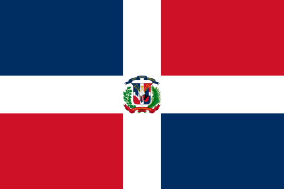 Flag of the Dominican Republic with a white cross dividing red and blue rectangles and a coat of arms at the center.