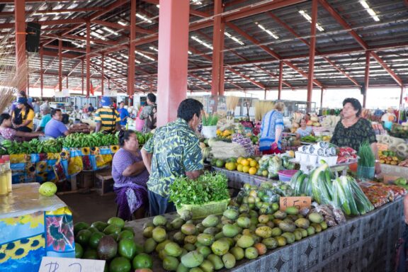 Local Vendors at a Tropical Fruit Market Locals at Fugalei Market, the pulse of Apia