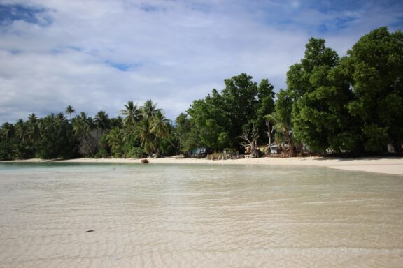 Tropical Beach with Clear Shallow Water Beaches near Funafuti, offering visitors a glimpse into the Pacific island paradise