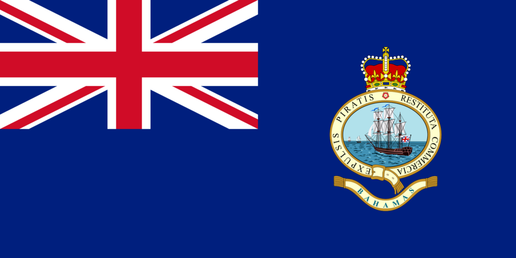 A historical flag of the Bahamas featuring the Union Jack in the top left corner and the Bahamian Coat of Arms on a blue field.