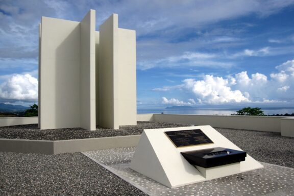Japanese War Memorial Monument Against Cloudy Sky Solomon Peace Memorial Park