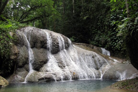Tropical Waterfall in Lush Forest Mataniko Falls, an important freshwater source for the region
