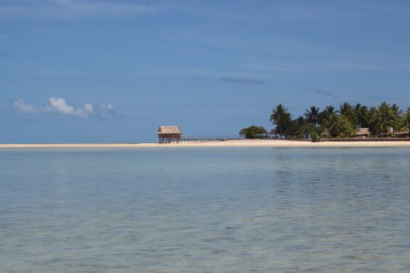 Tropical Beach with Hut on Stilts North Tarawa, a stark contrast to its southern counterpart