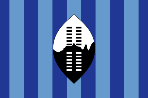Historical flag of Swaziland with a black and white shield and spears on a blue and white striped background.