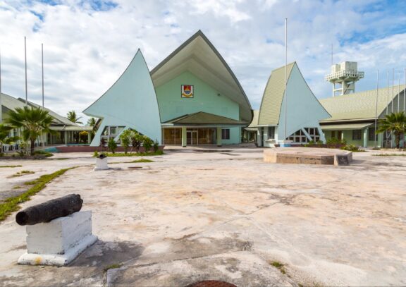 Tarawa Parliament Building with Cannon in Foreground Parliament of Kiribati in Tarawa, standing as a symbol of Kiribati's autonomy