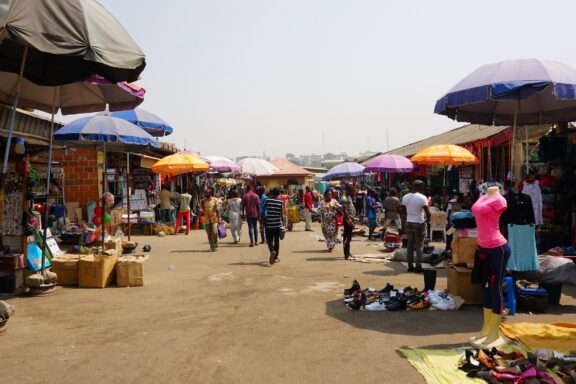 Bustling Outdoor Market with Colorful Umbrellas Wuse Market, a vital marketplace in Abuja
