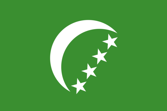 Flag of the Comoros with a green background, a white crescent, and four stars on the left side.