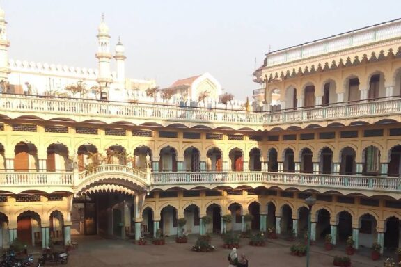 A view of a courtyard and large building in Saharanpur, India.