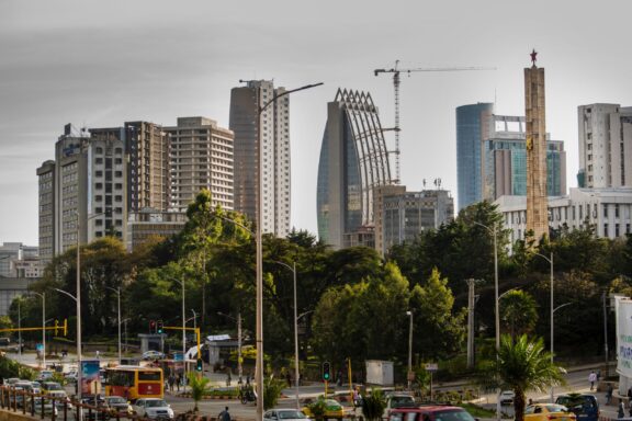 Urban Landscape of Addis Ababa with Skyscrapers and Construction Cranes Skyscrapers can be seen behind a highway with cars in Addis Ababa, the capital of Ethiopia.