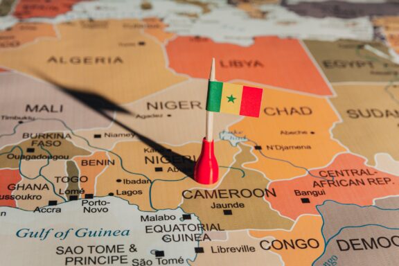 A map showing the location of Cameroon with a miniature flag placed on it.