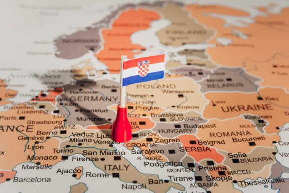 A pin with the flag of Croatia placed on a map, indicating the country's location in Europe.