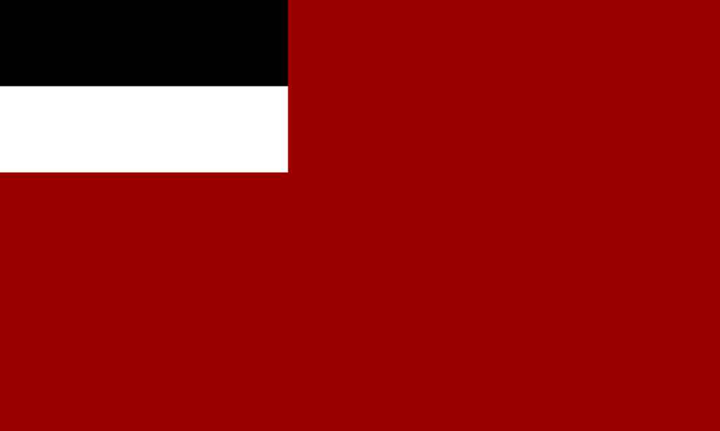 Historical flag of Georgia with black and white stripes on the top left corner and a red field.