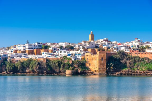 Kasbah of the Udayas Fortress and Surrounding Area in Rabat, Morocco The Kasbah of the Udayas can be seen across the water on a sunny day in Rabat, Morocco.
