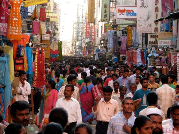 A crowded street full of people in Mumbai, India.