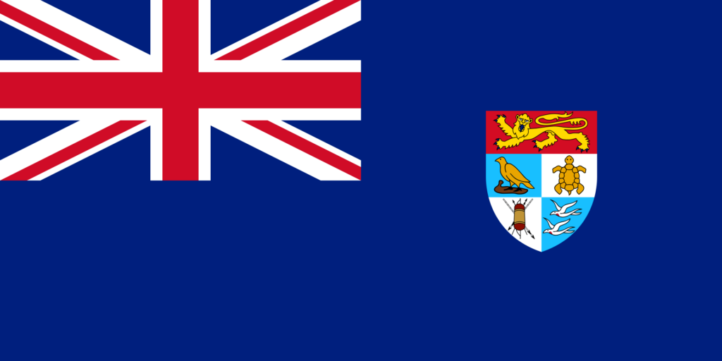 Flag of the Solomon Islands with a blue field, the Union Jack in the canton, and a shield bearing a yellow frigate bird over a traditional war shield and crossed spears.