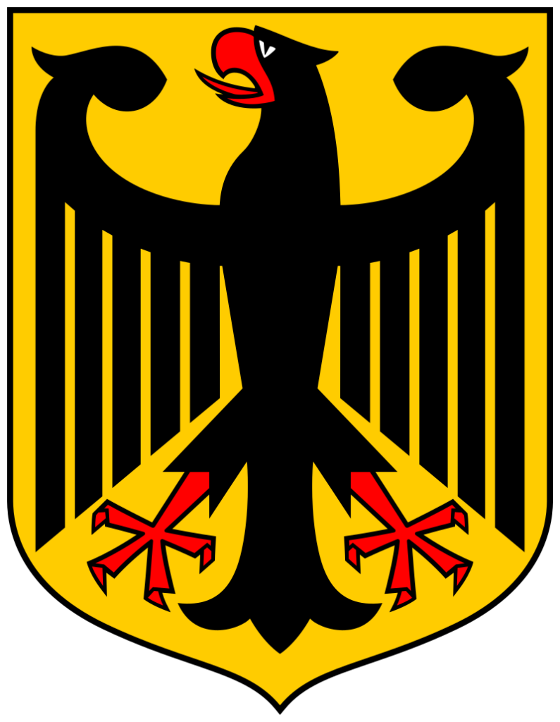 Black eagle with red beak and talons, clutching a red shield with a white cross, on a golden background.