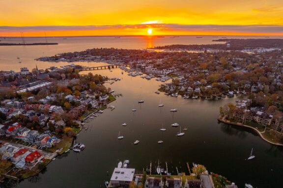 An aerial view of Annapolis Harbor and Chesapeake Bay at sunset.