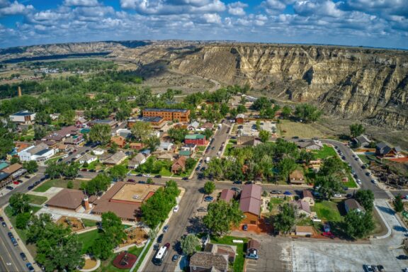 An aerial view of Medora, backed by cliffs, in North Dakota’s Billings County, outside of Theodore Roosevelt National Park.