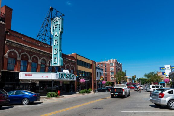 A street-level view of the Fargo Theatre on a sunny day in North Dakota’s Cass County.