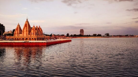 A view of a temple on a lake at dusk in the Indian state of Haryana.