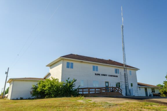 A low-angle view of the Slope County Courthouse is Amidon, North Dakota.