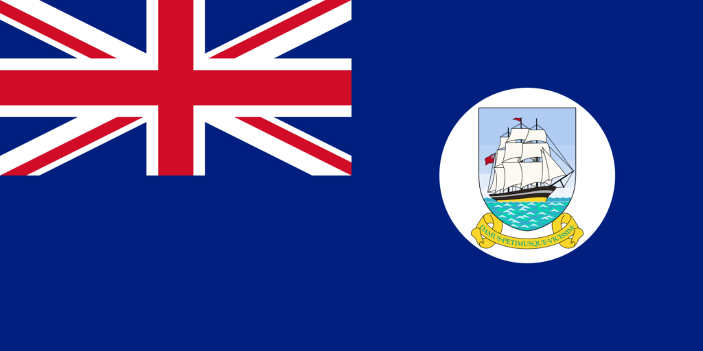 Flag of British Guiana with a Union Jack in the corner and a ship emblem on a blue background.