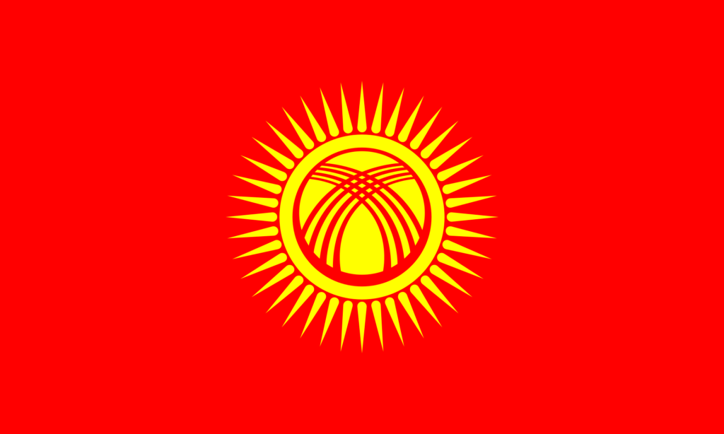 Flag of Kyrgyzstan with a red field and a yellow sun in the center featuring a stylized representation of a yurt.