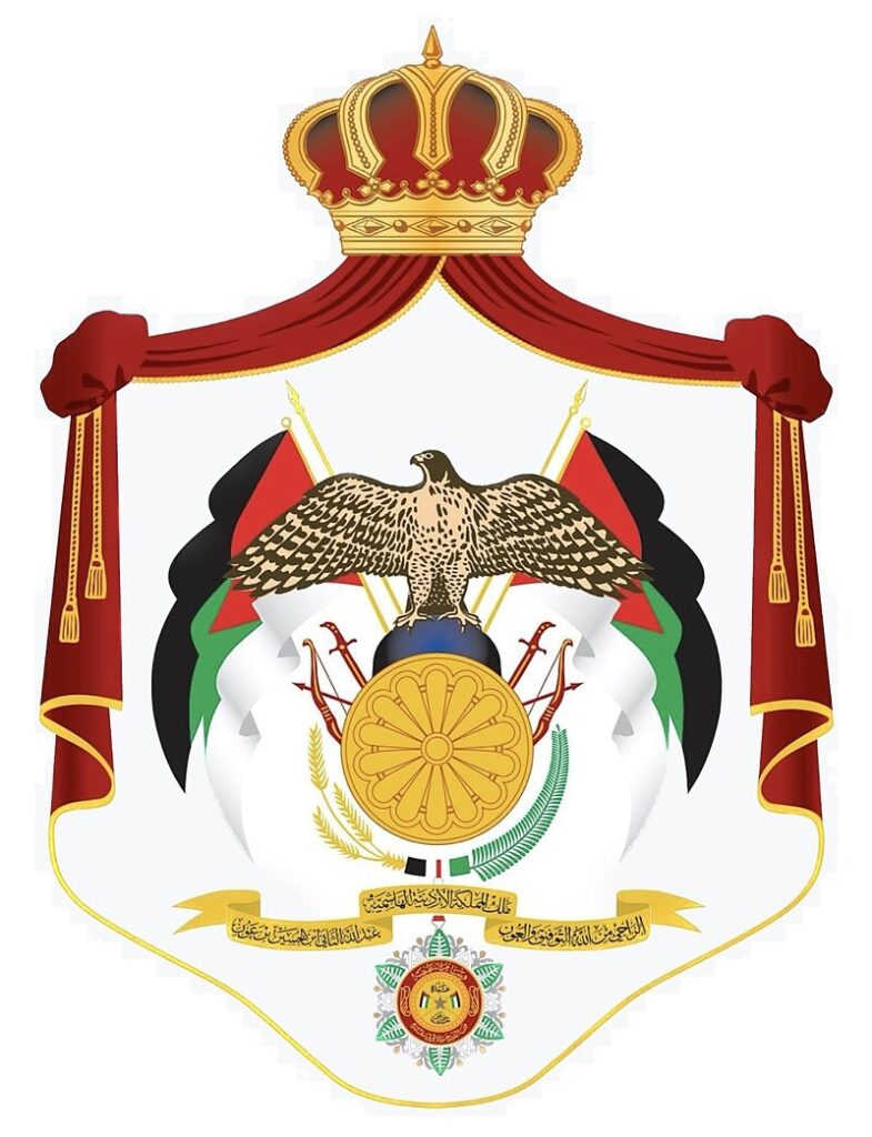 Emblem of Jordan featuring a crowned eagle, two Jordanian flags, a shield with a blue globe and golden wheel, and a decorative chain and medallion.