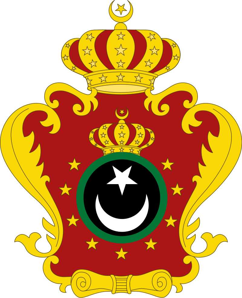 Coat of arms of the Kingdom of Libya featuring a red shield with a white crescent and star, surrounded by golden flourishes and topped with a crown.