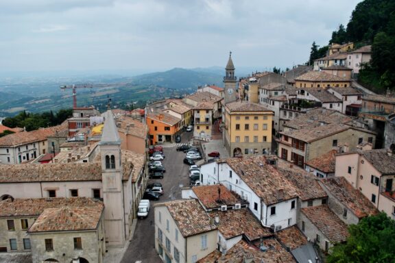 A view of the city in San Marino on a cloudy day.