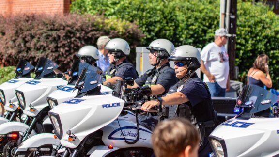 Police Officers on Motorcycles During a Parade Four police officers sit on motorcycles in Prattville, Alabama on a sunny day.