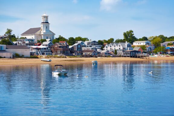 Buildings line a beach on a sunny day in Provincetown, Massachusetts.