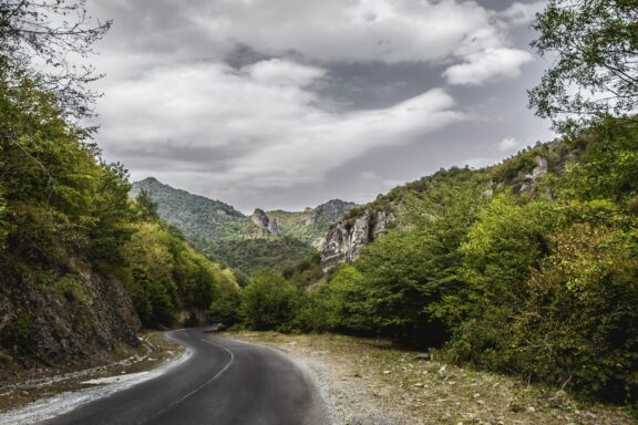 A road through the mountains on a cloudy day in Tovuz, Azerbaijan. 