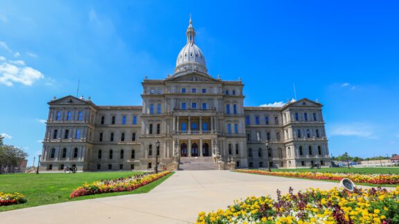 A low-angle view of the Michigan State Capitol building in Ingham County.