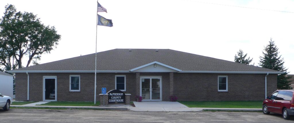 An American flag flies in front of the McPherson County Courthoue in Tryon, Nebraska.