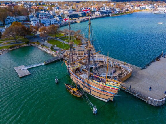 An aerial view of the Mayflower II ship at a dock in Plymouth, Massachusetts