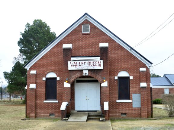 A closeup view of a small, brick church in Marks, Mississippi.