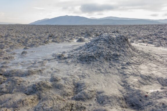 A field of mud extends into the distance in the Shirvan-Salyan Economic Region of Azerbaijan.