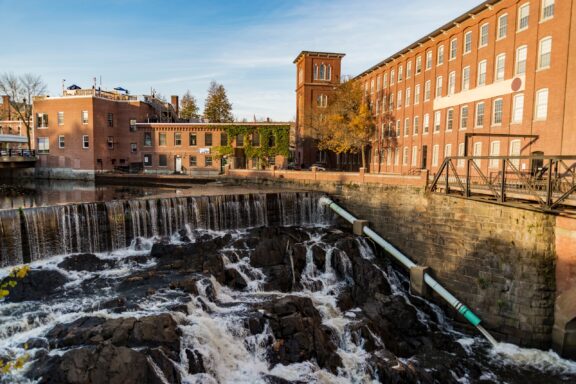 Water flows over rocks outside the Cocheco Mills in Strafford County, New Hampshire.