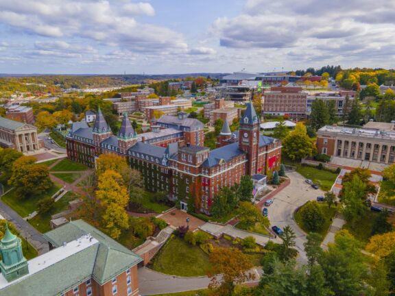 An aerial view of university buildings and trees in Worcester, Massachusetts.