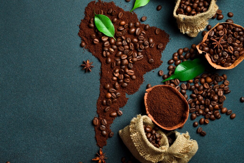 Set of coffee beans and ground coffee in the shape of a South America map.